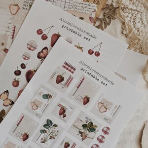May include: Printable sticker sheet with a red and white gingham pattern, strawberries, butterflies, and cherries. The sheet includes the text "Albumlovehandmade printable set".