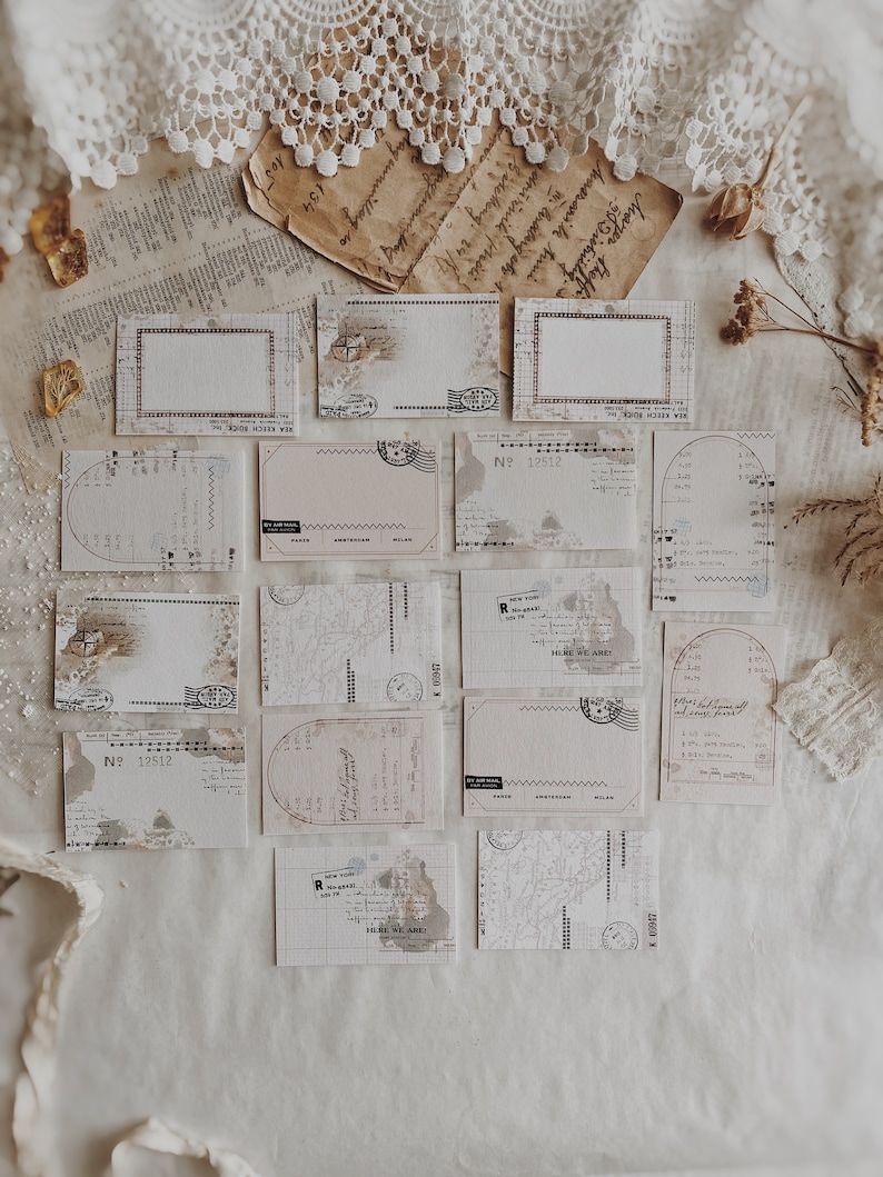 May include: A collection of vintage-style blank cards with a distressed, aged look. The cards feature various designs, including a map, a grid, and a stamp. The cards are perfect for journaling, scrapbooking, or adding a touch of vintage charm to your crafts.