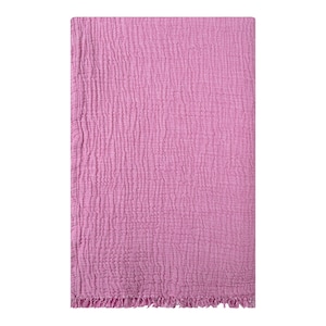 May include: A soft, pink, textured throw blanket with a fringed edge.