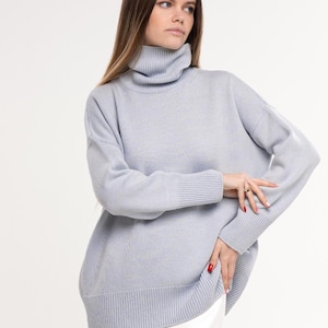 Sky Blue wool overcoat jumper with high neck for women, knitted from Italian merino yarn soft and cosy