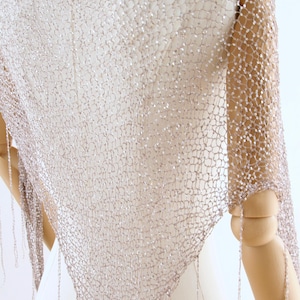 Hand knitted sparkly shawl for brides, featuring shimmering sequins and a delicate lightweight design.