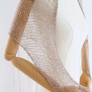 Elegant silver bridal accessory that can be worn as a shawl, wrap or triangle scarf for special occasions.