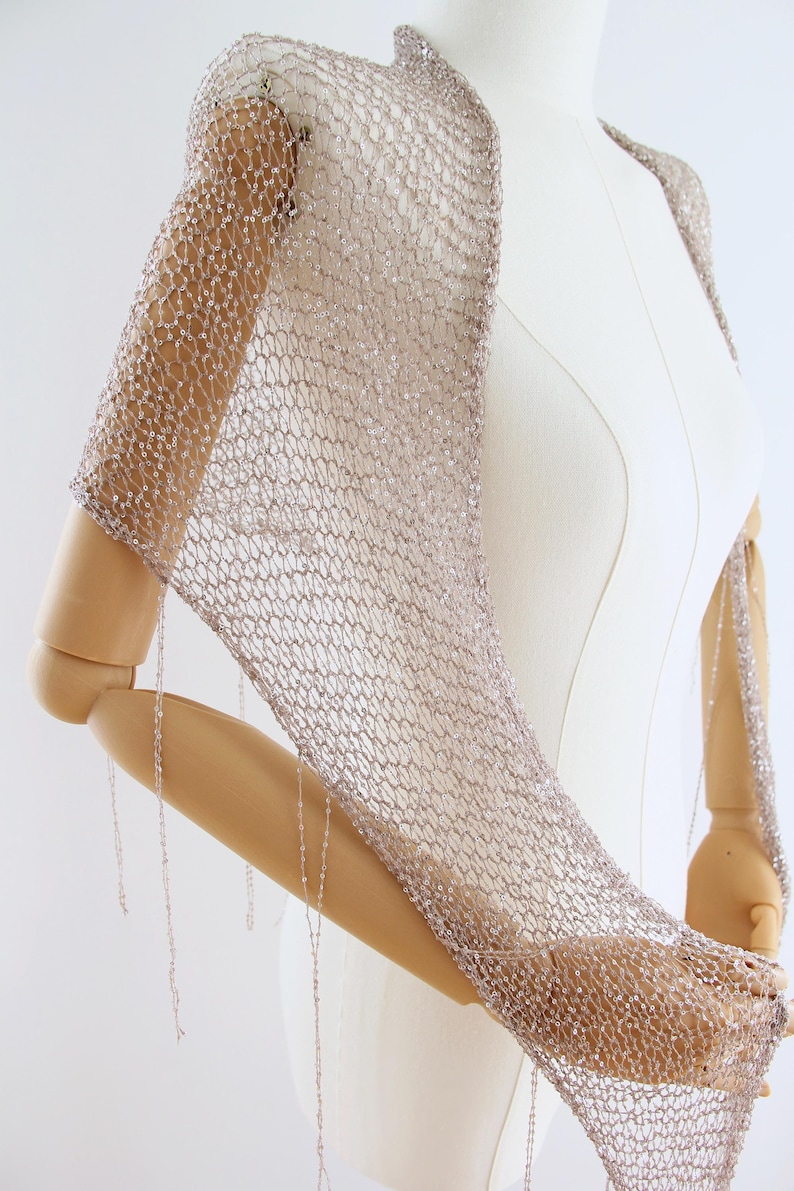 Elegant silver bridal accessory that can be worn as a shawl, wrap or triangle scarf for special occasions.