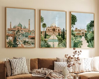 May include: A set of three framed wall art prints featuring watercolor-style illustrations of historical architecture. The left print shows a city skyline with domes and minarets, the center shows a domed building with gardens, and the right shows a stone archway.