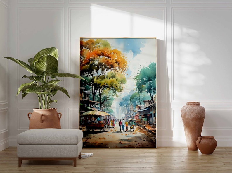 May include: Watercolor painting of a street scene in a village. The painting features a group of people walking down a street lined with trees and buildings. The sky is blue with white clouds. The painting is framed in a gold frame.