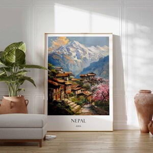 May include: A framed print of a painting depicting a village nestled in the Himalayas, with snow-capped mountains in the background. The print has the word "NEPAL" and "ASIA" written at the bottom.