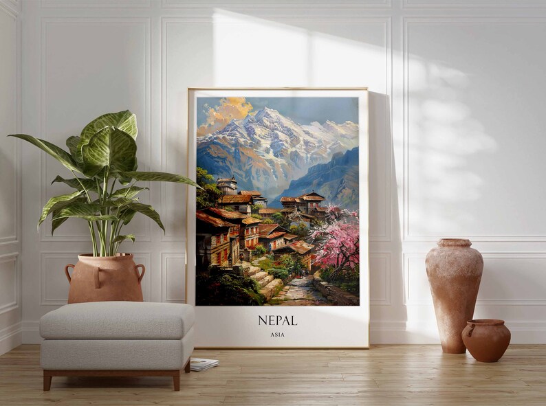 May include: A framed print of a painting depicting a village nestled in the Himalayas, with snow-capped mountains in the background. The print has the word "NEPAL" and "ASIA" written at the bottom.