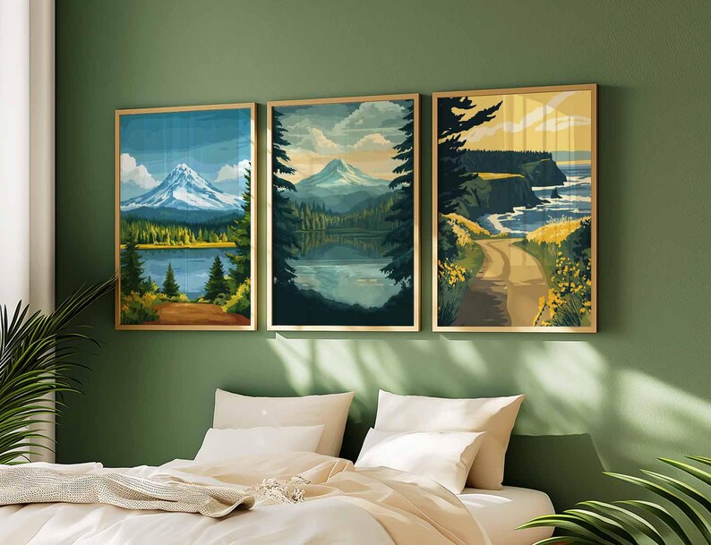 May include: Three framed landscape art prints. The prints depict mountain scenes, lakes, and coastal views. The artwork features a color palette of blues, greens, and yellows, with gold frames. The art is displayed above a bed with white bedding and pillows.