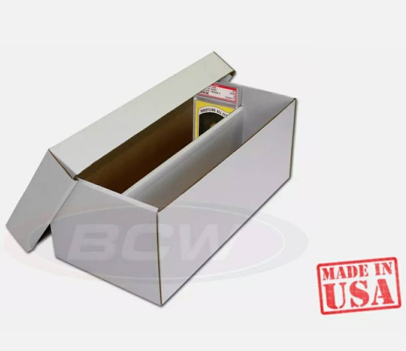 May include: White cardboard box with a lid open, revealing a white foam insert for storing trading cards. The box is labeled "Wrestling All Stars".