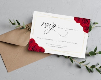May include: A white RSVP card with a gold frame and red roses in the corner. The text on the card reads "RSVP by 1st September 2025. We have reserved ____ seat(s) in your name. To RSVP please visit our website www.yourwedding.website"