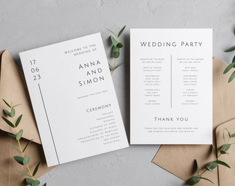 May include: Two white wedding programs with black text, featuring the names "Anna and Simon" and "Wedding Party." The programs include ceremony details and guest lists, with a date of June 17, 2023. They rest on a neutral background with brown envelopes and greenery.