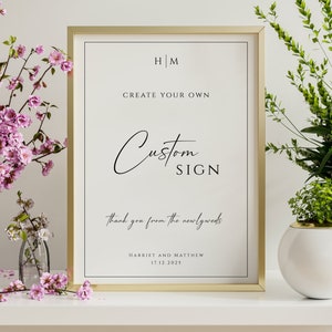 May include: A gold framed sign with the text "HM Create Your Own Custom Sign Thank you from the newlyweds Harriet and Matthew 17.12.2025" on a white background.