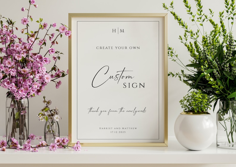 May include: A gold framed sign with the text "HM Create Your Own Custom Sign Thank you from the newlyweds Harriet and Matthew 17.12.2025" on a white background.
