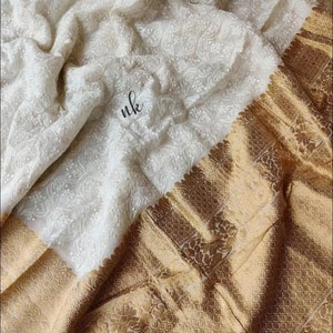 Designer Khaddi georgette saree with beautiful Chikankari work.