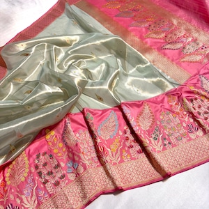 This is a masterpiece saree Handloom woven pure kora tissue body and kadhyal katan silk tilfi multi minakari big border buti saree