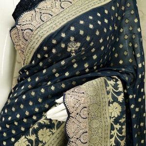 Soft khaddi Georgette saree with beautiful zari buties all over with big floral border highlighted with designer zardozi border