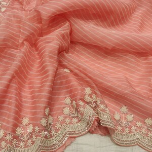 Organza fabric with hand embroidery.