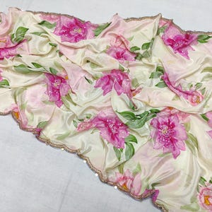 Classic floral printed schamooz sarees with an intricate handwork scalloped border and crystal highlights