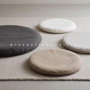 May include: Four round floor cushions in different colors and fabrics. The cushions are made of a soft, natural material and are perfect for adding a touch of comfort and style to any room.