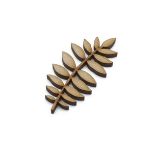 May include: A wooden leaf sprig with a natural brown color. The leaf sprig is made of multiple individual leaves that are connected to a central stem.