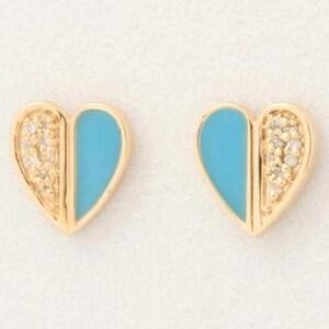May include: A pair of gold heart-shaped stud earrings. Each earring is divided vertically into two sections: one side features a smooth, bright turquoise enamel inlay, while the other side is encrusted with a cluster of small, clear, sparkling stones.