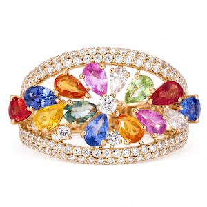 May include: A gold ring featuring a floral design with a central diamond surrounded by colorful, pear-shaped gemstones. The ring is encrusted with small diamonds along the band and around the central design.