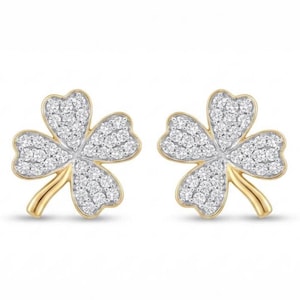 May include: A pair of stud earrings shaped like four-leaf clovers. Each earring features a gold-toned metal frame and is encrusted with numerous small, clear, sparkling stones covering the entire surface of the clover leaves.