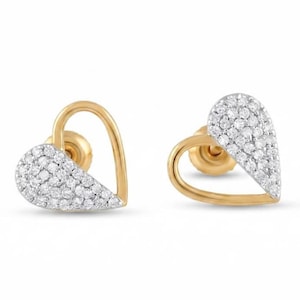 May include: A pair of stud earrings featuring a gold heart-shaped outline. One side of each heart is filled with a cluster of small, clear, round-cut stones, while the other side remains a smooth, polished gold band with a secure post backing.
