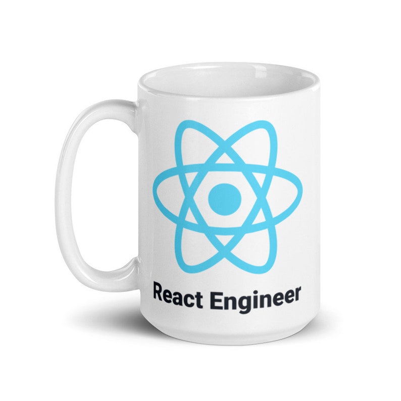 May include: White ceramic mug with a light blue atom symbol and the text "React Engineer" in black. The mug has a curved handle and a glossy finish. Suitable for hot or cold drinks.