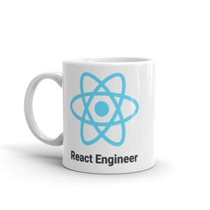 May include: White ceramic mug featuring a light blue atom symbol and the text "React Engineer" in black. The mug has a curved handle, suitable for hot drinks.
