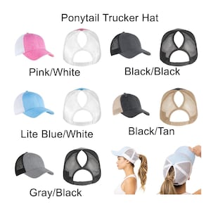 May include: Assortment of ponytail trucker hats in various colors. The hats are made of a mesh fabric with a solid colored front panel and a white back panel. The hats have a ponytail opening in the back. The colors include pink, black, light blue, gray, and tan.