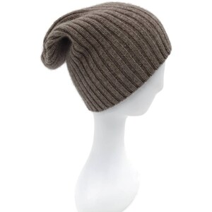 May include: A brown ribbed knit beanie hat on a white mannequin head.