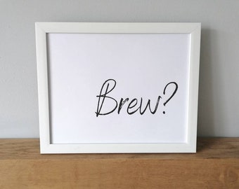 Puede incluir: Impresión enmarcada en blanco con el texto "Brew?" en escritura cursiva negra.