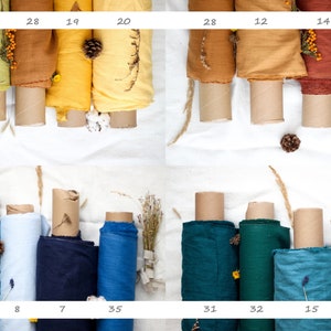 May include: A collection of 10 fabric rolls in various colors, including green, yellow, orange, brown, blue, and teal. The fabric rolls are arranged in two rows of five, and each roll is labeled with a number.