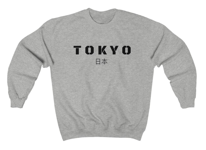 May include: A gray sweatshirt with black text that reads "TOKYO 日本".