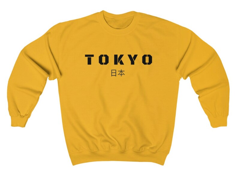 May include: A yellow sweatshirt with black text that says "TOKYO 日本".