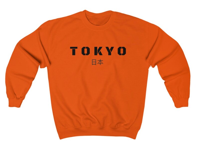 May include: Orange sweatshirt with black text that reads "TOKYO 日本" (Japan in Japanese).