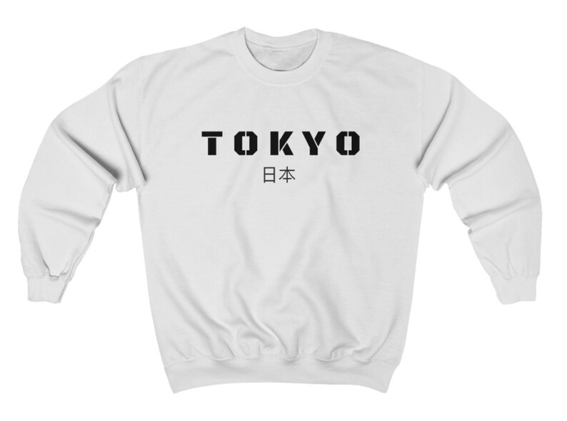 May include: White sweatshirt with black text that reads "TOKYO 日本" (Japan in Japanese).