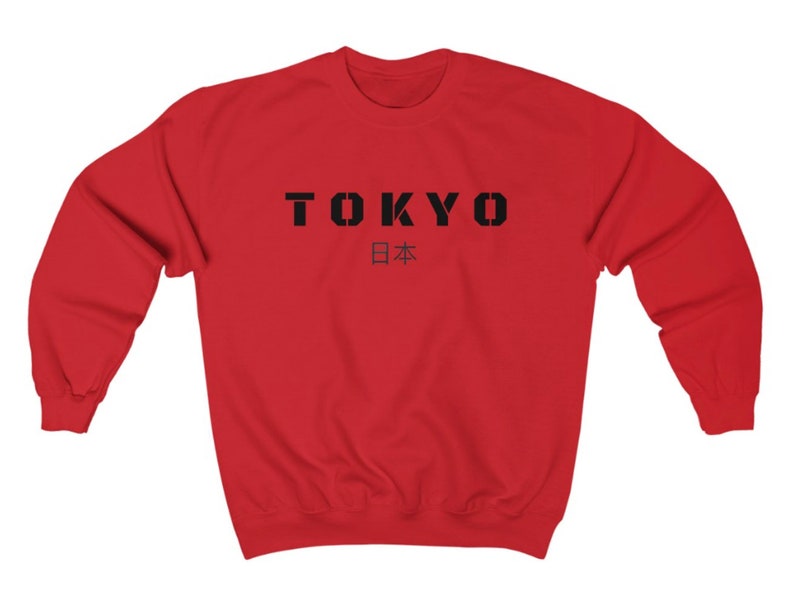May include: Red sweatshirt with black text that says "TOKYO" and "日本" in Japanese characters.