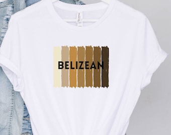 May include: White t-shirt with a graphic of a colorful stripe pattern and the word "Belizean" in black text.