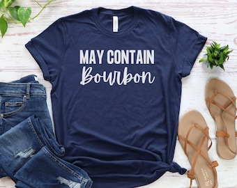 May include: A navy blue t-shirt with the text "May Contain Bourbon" in white lettering.