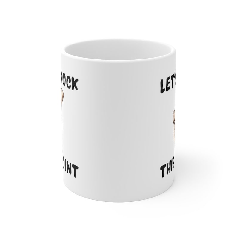May include: White ceramic mug with black text that reads "Let's Rock This Joint".