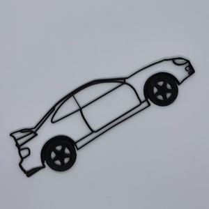 May include: A black line drawing of a car with a side profile view. The car has a rounded body style and large wheels. The car is drawn in a simple, minimalist style.