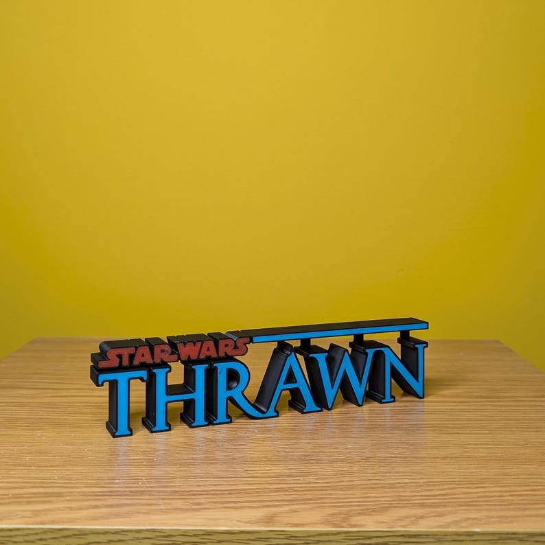 May include: A blue and black 3D printed sign that reads "Star Wars Thrawn".