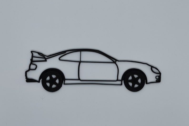 May include: A black line drawing of a coupe car with a rear spoiler. The car is facing to the right and has a simple design.