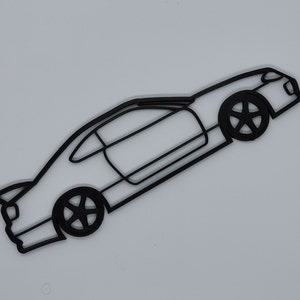 May include: Black line art silhouette of a sports car with a spoiler, side windows, and wheels. The car is facing the right side of the image and is angled slightly upward.
