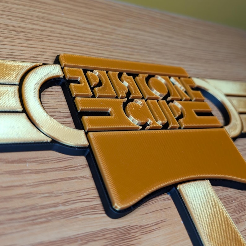 May include: A 3D printed wall decor with the words "Smoke Club" in a stylized font. The decor is made of brown plastic and has a textured surface.