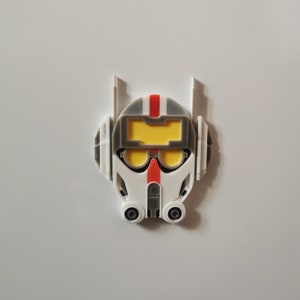 May include: A white, gray, and red 3D printed helmet with a yellow visor and two black goggles. The helmet has a red stripe on the top and two antennas on the top.