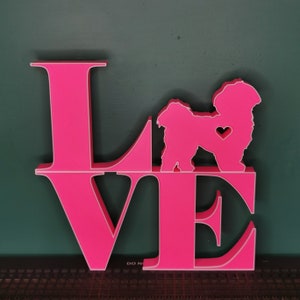 May include: Pink wooden "LOVE" sign with a white silhouette of a dog in the center of the "O". The dog has a small heart on its chest.