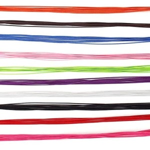 May include: A collection of colorful cords in various shades, including red, orange, brown, blue, pink, green, purple, white, and black. The cords are arranged horizontally against a white background, creating a vibrant and visually appealing display.